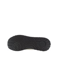 Rubber sneaker sole with a textured, patterned surface. Features a traction design with grooves for grip and a circular emblem.