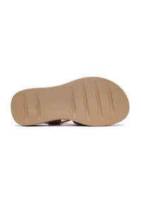 Suola in gomma marrone con diverse scanalature per una migliore trazione. Testura liscia e forma arrotondata, progettata per il comfort e la stabilità.