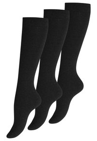 Calze nere fino al ginocchio realizzate in un materiale a maglia liscia, con una consistenza uniforme e una parte superiore elastica leggera per una vestibilità sicura. Set di tre.
