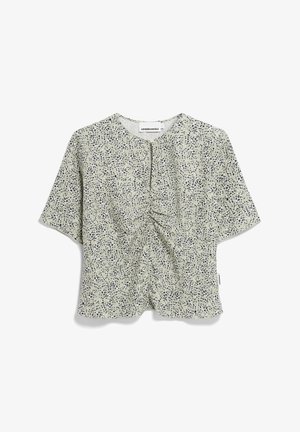 Korte mouwen top in lichtgroen met een verspreid marineblauw patroon, voorzien van een gerimpeld ontwerp aan de voorkant en een ronde halslijn. Zachte stoftextuur.