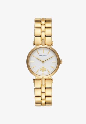 Montre dorée avec un cadran blanc rond, des index dorés et un logo bien visible. Le bracelet est composé de maillons carrés pour un look structuré.