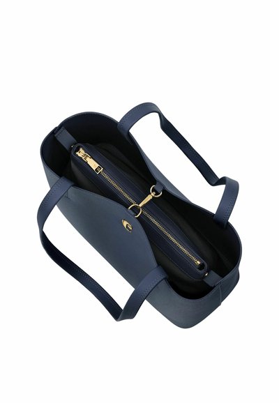 Torba iz mornarsko modrega platna z dvema ročajema, s centralnim predalom z zadrgo in zlatimi detajli ter odprtim glavnim predelom.