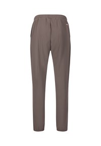 Braune, leichte Sportpants mit elastischem Bund, schmal zulaufenden Beinen und zwei Seitentaschen. Glatte Textur, keine Muster oder zusätzlichen Akzente.