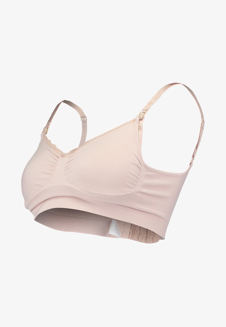 Sutiã sem costura em rosa claro com alças ajustáveis, tecido macio e faixa elástica. Apresenta detalhes franzidos nas copas para modelagem.
