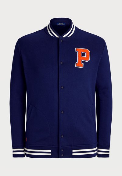 Navy blue varsity jacket with a red embroidered "P" logo, white striped ribbed collar and cuffs, button closure, and side pockets.