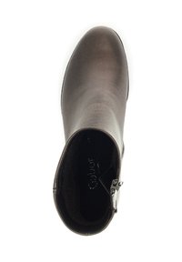 Brown ankle boot with a smooth texture, rounded toe, and a side zipper. Features minimalistic design and soft inner lining.