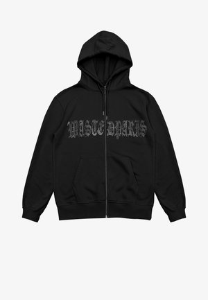 Felpa nera con cerniera in tessuto morbido, dotata di cappuccio, tasche frontali e scritta "WASTE PARIS" in uno stile testurizzato e consumato.