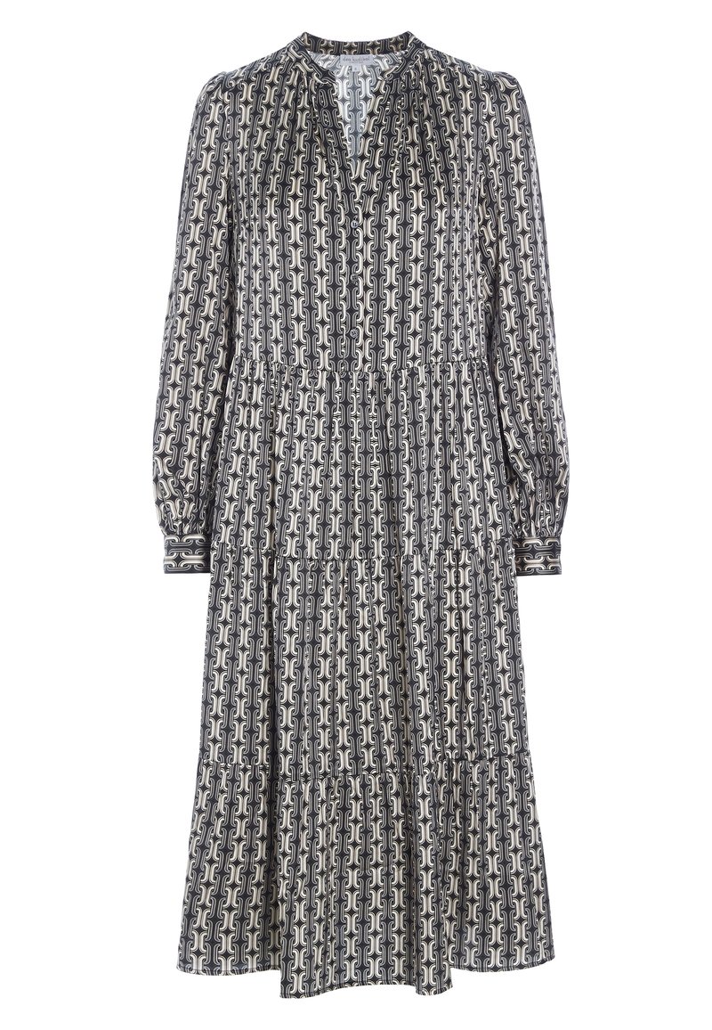 Robe midi à manches longues noire et blanche à motifs, jupe à volants et décolleté en V, présentant un motif géométrique en forme de maillons de chaîne sur toute la surface.