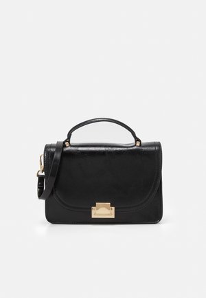 Black leather handbag with top handle, adjustable shoulder strap, and gold rectangular clasp closure on front flap.