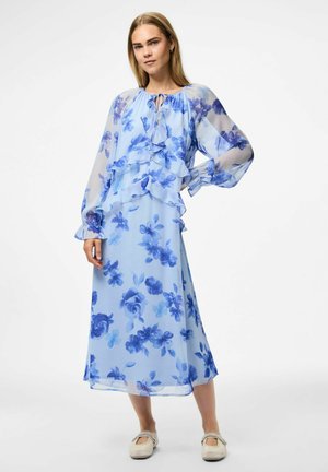 Light blue floral maxi dress made of sheer fabric, featuring ruffled layers, long sleeves, and a round neckline with a tie.