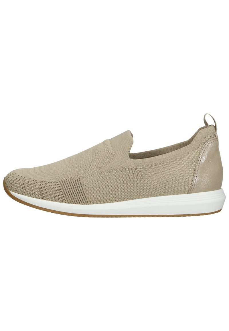 Beige slip-on shoe with textured fabric, elastic side panels, and a white sole. Smooth back with a small pull tab for easy wear.