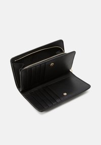 Black leather wallet with a zipper compartment, multiple card slots, and a snap closure. Smooth texture and gold-tone hardware accents.