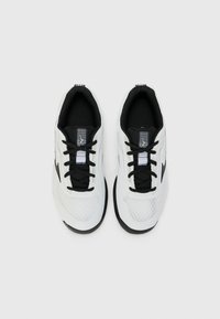 White athletic shoes with black laces, textured mesh sections, and a black sole. Features a logo on the tongue and a simple design.