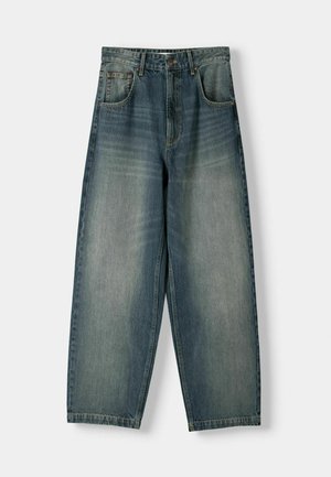 Hellblaue weite Jeans aus Denim mit einem ausgewaschenen Look, fünf Taschen und genähten Details entlang der Nähte.