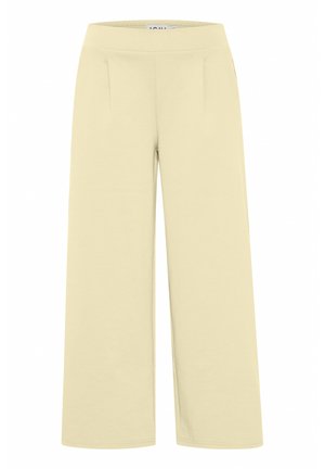 Gaiši dzelteni platajā kāja bikses, kas izgatavotas no mīksta kokvilnas maisījuma ar gludu tekstūru, ar sānu kabatām un elastīgu jostasvītru.