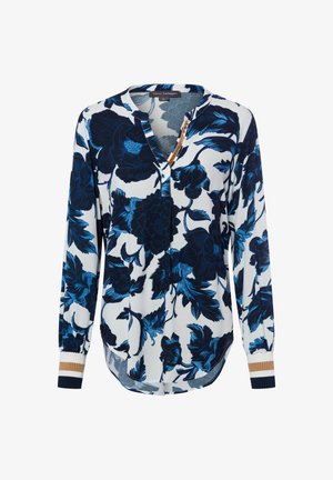 Floral blouse featuring a navy blue and white design, long sleeves, a v-neck, and ribbed cuffs with accents of gold and navy.