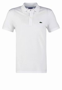 Biała koszulka polo wykonana z bawełny, z klasycznym kołnierzykiem, krótkim rękawem i zielonym logo Lacoste na lewej piersi.