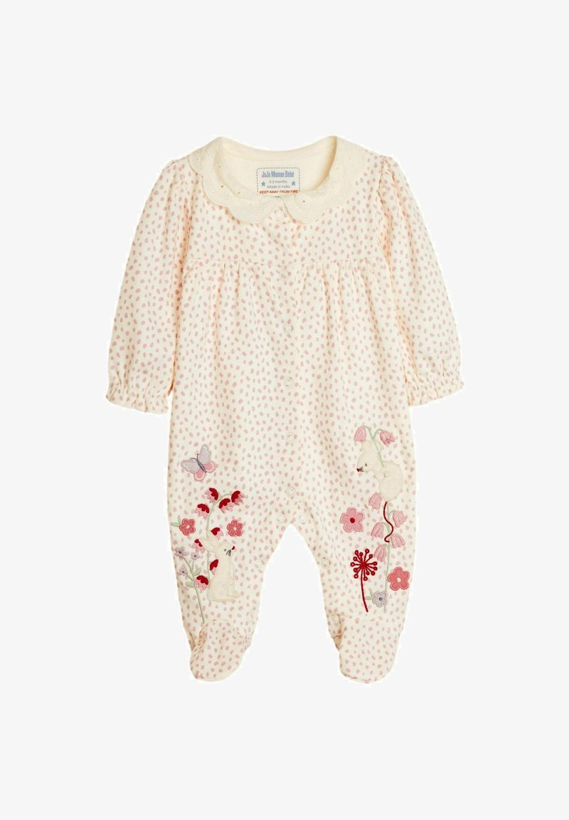 Krémový dojčenský overal s ružovými bodkami, so vyšitými kvetinovými a zajačími motívmi, doplnený okrajom s vlnkami.