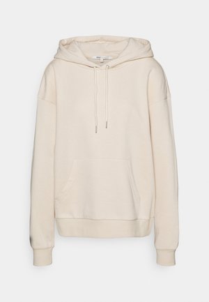 Bluza z kapturem w kolorze kremowym z przednią kieszenią kangurzą, kapturkiem ze sznurkiem, długimi rękawami oraz prążkowanymi mankietami i dołem, przedstawiona na jednolitym tle.
