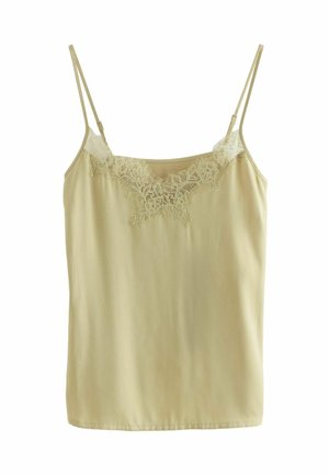 Camisole beige sans manches avec fines bretelles réglables et détails de dentelle florale complexe le long de l'encolure.