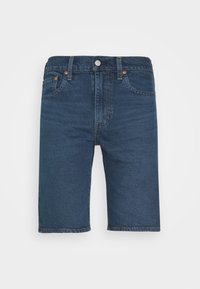 Jeansshorts i en mörkblå tvätt, med knäppning, femficksdesign och sydda detaljer längs sömmarna och fållen.