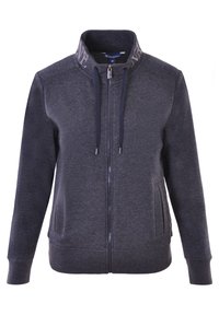 Sweat-shirt zippé gris foncé avec un col haut, des détails à cordon de serrage, des poches sur les côtés et des poignets côtelés. Fabriqué à partir d'un tissu doux et texturé.