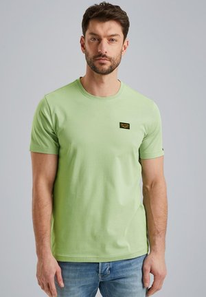 Light green short-sleeve t-shirt made of cotton, featuring a small black label on the chest. Smooth texture with a round neckline.