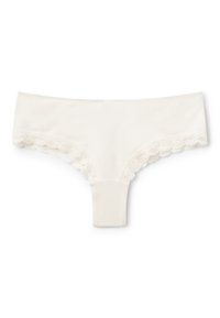 String in pizzo con bordi scallopati, tessuto morbido, design a vita bassa e costruzione senza cuciture per comfort e discrezione.