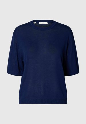 Jersey de punto azul marino de manga corta con cuello redondo y puños y bajo acanalados, presentado sobre un fondo liso gris claro.