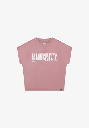 Pinkfarbener, kurz geschnittener T-Shirt aus Baumwolle mit Rundhalsausschnitt. Mit fettem weißen Schriftzug "BIARRITZ" auf der Vorderseite und kurzen Ärmeln.