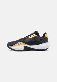 Black and gold athletic shoes with a textured finish, featuring a rubber sole, lace-up front, and prominent branding on the side.