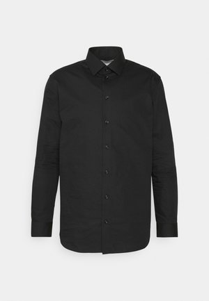 Zwarte, lange mouwen, knoopsluiting shirt, gemaakt van gladde stof. Beschikt over een klassieke kraag, knopen aan de voorkant en een rechte zoom.