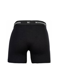Zwarte boxershorts gemaakt van zacht materiaal met een aansluitend ontwerp. Voorzien van een merk-elastische tailleband met "SCOTCH & SODA" in witte tekst.