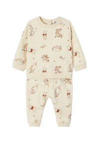 Beige Sweatshirt- und Hosen-Set mit einem Allover-Druck von Winnie Puuh und seinen Freunden in Brauntönen. Weicher Stoff, gerippte Bündchen.