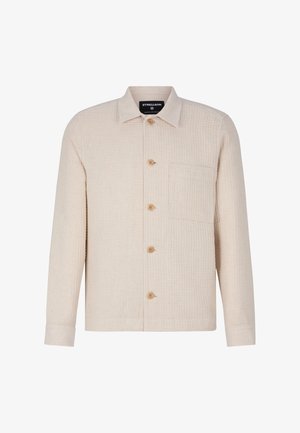 Crème-kleurige shirtjack gemaakt van textuurstof, met een knoopsluiting aan de voorkant, drie zichtbare knopen en een borstzak.