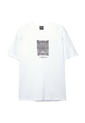 Bela bombažna majica s kratkimi rokavi in krožnim izrezom. Ima črn grafični tisk okrasnega okvirja z napisom "SPREJEM" spodaj.