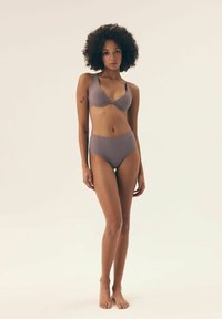 Gray bikini set featuring a v-neck bra with adjustable straps and high-waisted bottom with scalloped edges, made from smooth fabric.