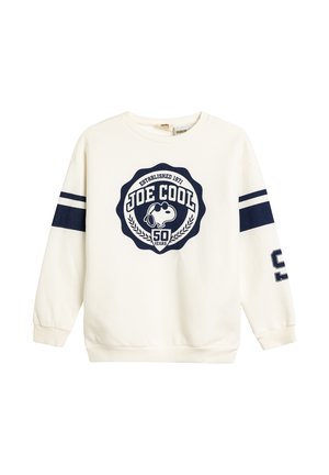 Felpa crema con strisce blu navy sulle maniche, caratterizzata da un logo grafico centrale di un cane con occhiali da sole, con il testo "JOE COOL" e accenti di alloro.