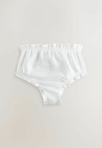 Hvide bomuldsunderbukser med en elastisk taljebånd, blød tekstur og mellemhøj talje. Har et enkelt, ubesmykket design.