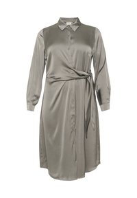 Langärmeliges Hemdkleid in gedecktem Grau, aus glattem Stoff gefertigt. Verfügt über einen Kragen, eine Knopfverschluss und eine geschnürte Taillendetail für die Form.