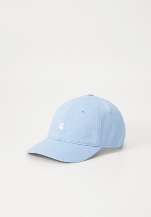 Light blue cotton baseball cap with a curved peak, six-panel design, eyelet vents, and a small white embroidered logo on the front.
