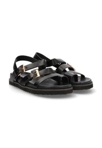 Sandalias de cuero negro con múltiples correas cruzadas, hebillas en tono dorado, diseño de punta abierta y suela de goma texturizada.
