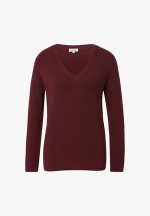 Burgundi spalvos megztinis su ilgomis rankovėmis ir giliu V-žandikauliu, pasižymintis įriboja tekstūra ir laisvu siluetu, be matomų logotipų ar raštų.