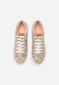 Beige patterned sneakers with white laces and a white sole. Features a subtle floral design, leather accents, and a pink interior lining.