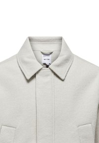 Light grey wool coat featuring a classic collar, two front pockets, and a textured finish. Tag visible inside the collar area.