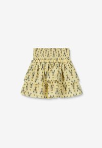 Jupe longue jaune à volants avec une taille smockée, ornée d'un motif de homard et de cœur. Fabriquée en tissu léger au toucher doux.