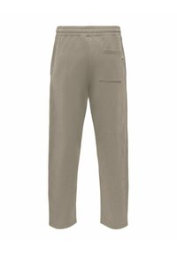 Jasnobeżowe spodnie dresowe wykonane z miękkiego materiału, z elastycznym pasem, bocznymi kieszeniami oraz naszywaną kieszenią z tyłu. Prosty krój nogawek.