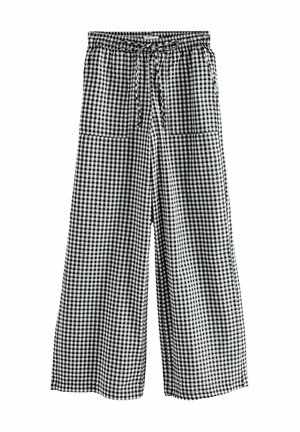 Zwart-witte geruite wijde broek met elastische tailleband en voorste trekkoord, voorzien van twee voorzakken.
