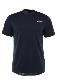 Marinblå pikétröja gjord av mjukt, lätt tyg. Har en tvåknappig knappslå och en liten vit Nike-logotyp på vänster bröst.