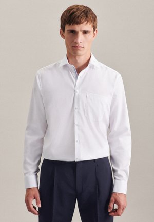 White long-sleeve button-up shirt with a breast pocket, featuring a light blue accent inside the collar and a classic fit.